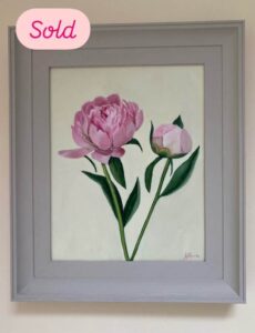 An image of a framed oil painting of pink peonies on a cream background