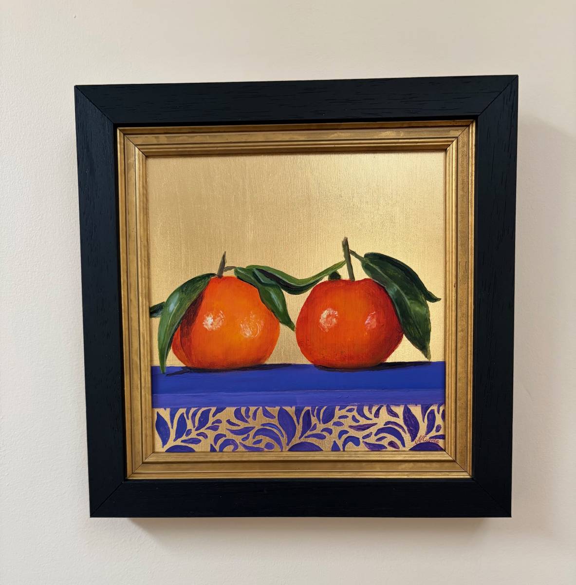 Framed original oil painting of two satsumas on a purple cloth with a gold leaf background