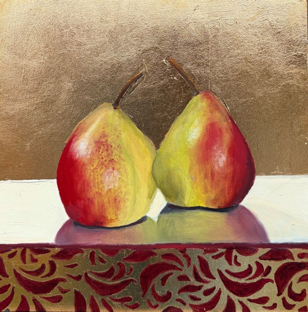 An oil painting of two pears on an imitation gold leaf background with a crimson decorative pattern under the pears by artist Nicola Currie