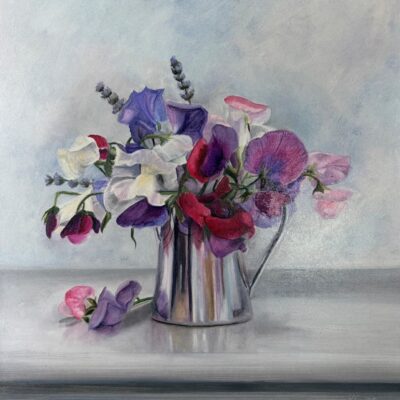 An oil painting by British artist Nicola Currie of purple, pink and white sweet peas in a silver jug on a grey blue background